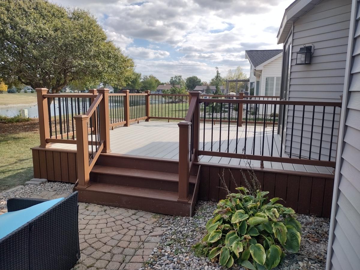 Composite deck with stairs and patio area
