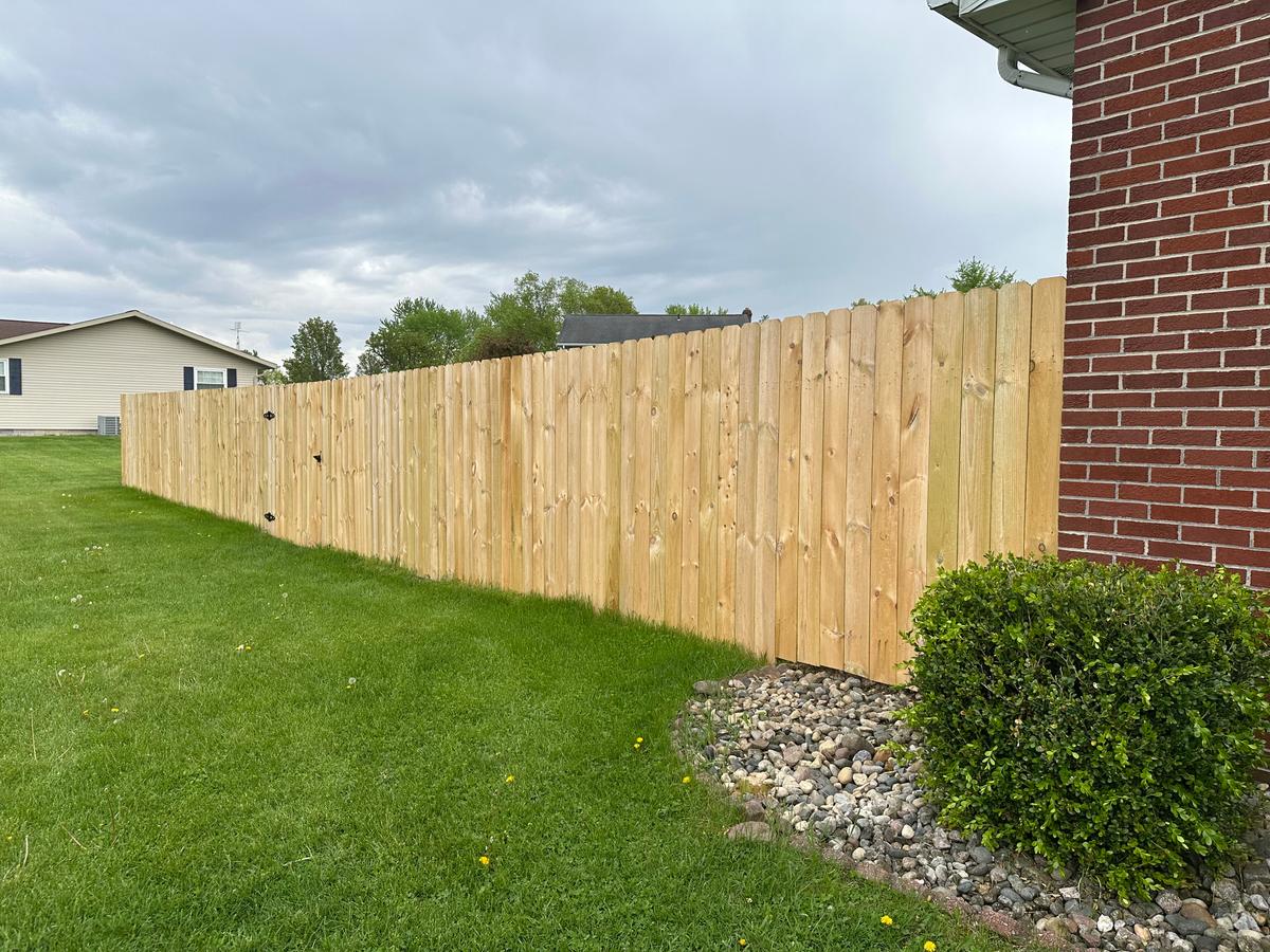 Wood privacy fence with brick house in Ohio