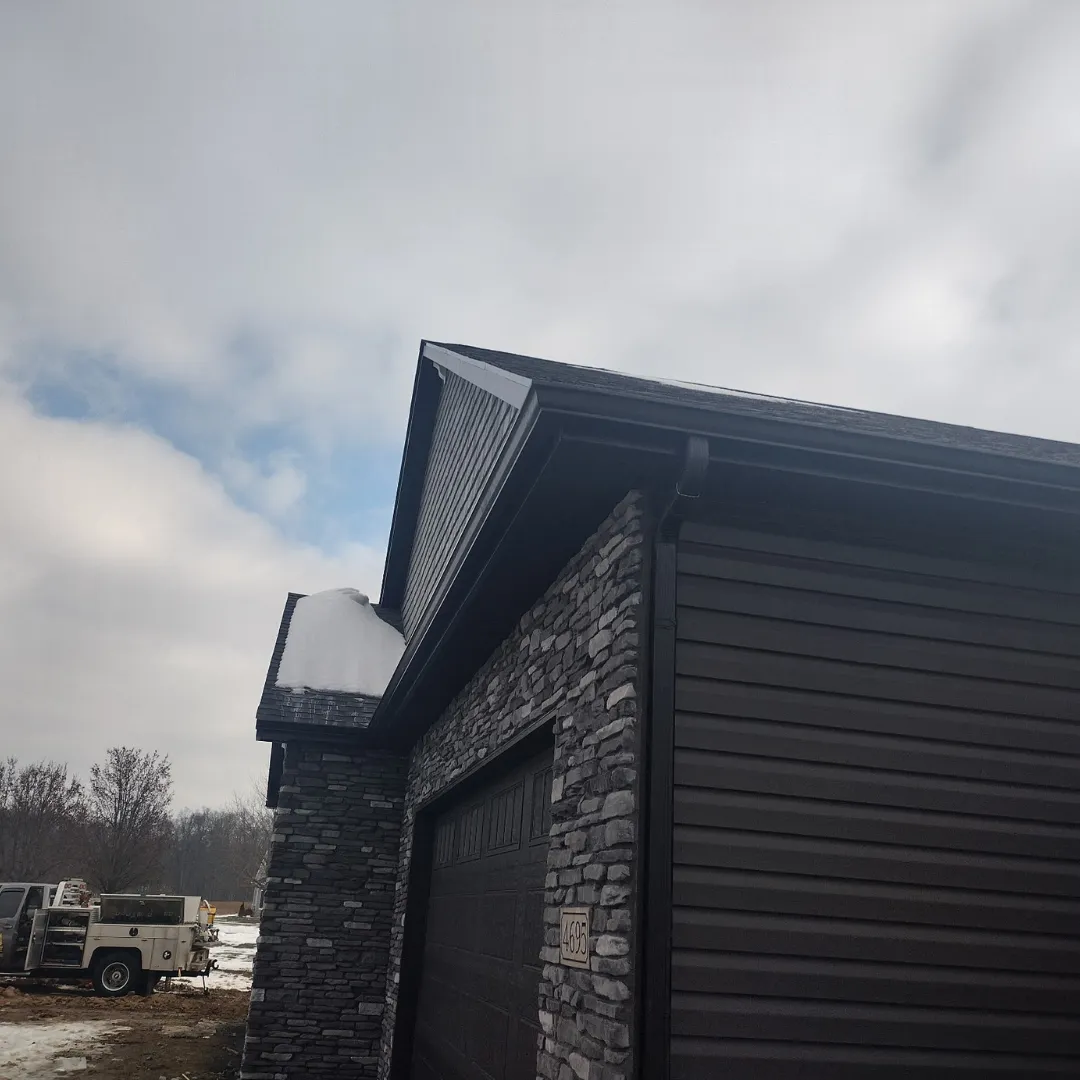 Gutter corner detail on dark stone building